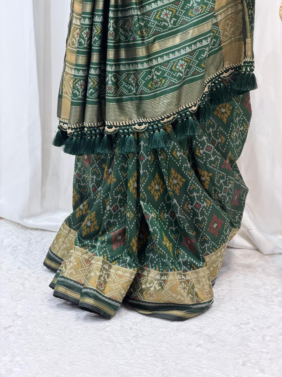 Regal Green Silk Saree with Intricate Weaving
