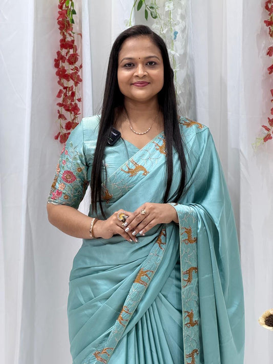 Festive Wear Aqua Blue Saree with Unique Animal Pattern Border