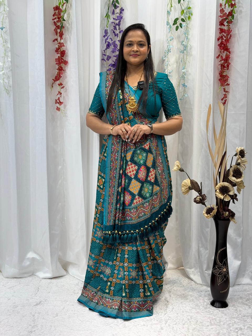Festive Teal Green Saree with Intricate Traditional Patterns