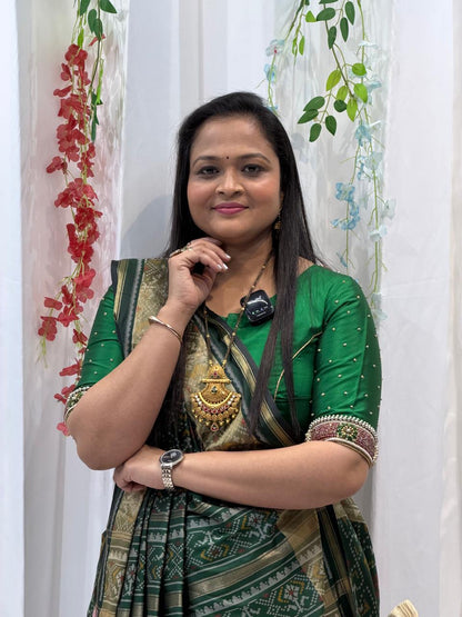 Regal Green Silk Saree with Intricate Weaving