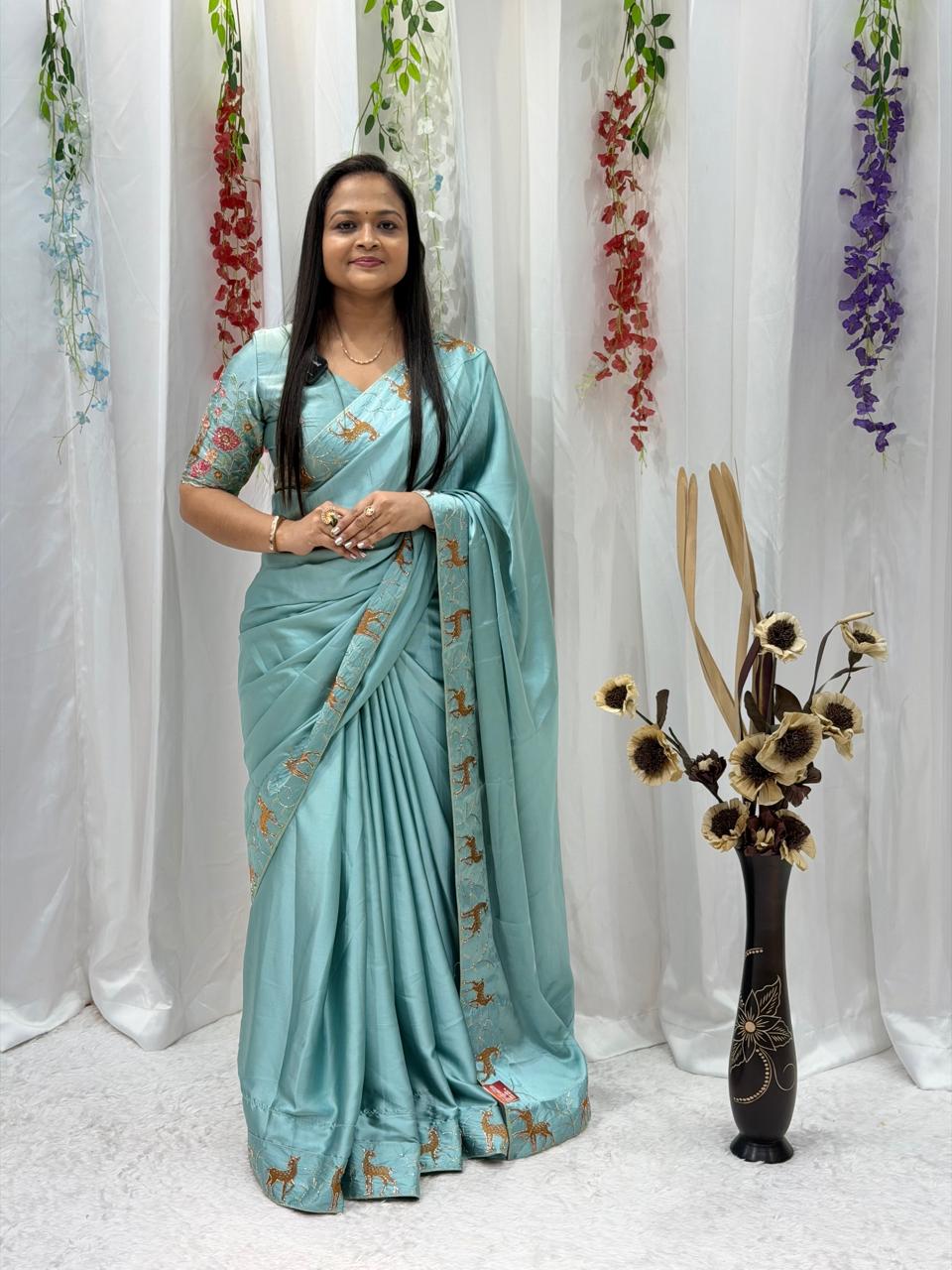 Festive Wear Aqua Blue Saree with Unique Animal Pattern Border