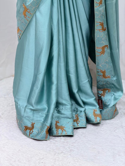Festive Wear Aqua Blue Saree with Unique Animal Pattern Border