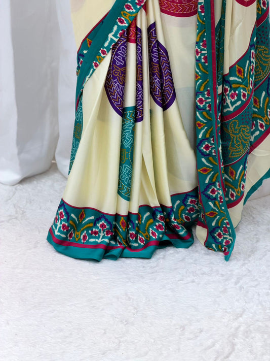 Elegant Cream Printed Saree with Teal Border & Multicolor Traditional Motifs