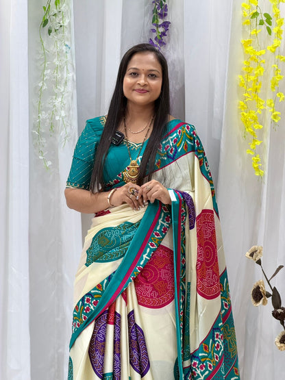 Elegant Cream Printed Saree with Teal Border & Multicolor Traditional Motifs