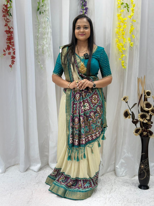 Elegant Cream & Teal Patola Print Saree with Rich Pallu & Tassel Detailing