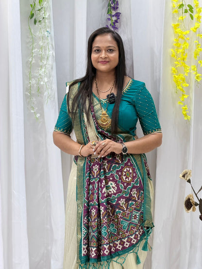 Elegant Cream & Teal Patola Print Saree with Rich Pallu & Tassel Detailing