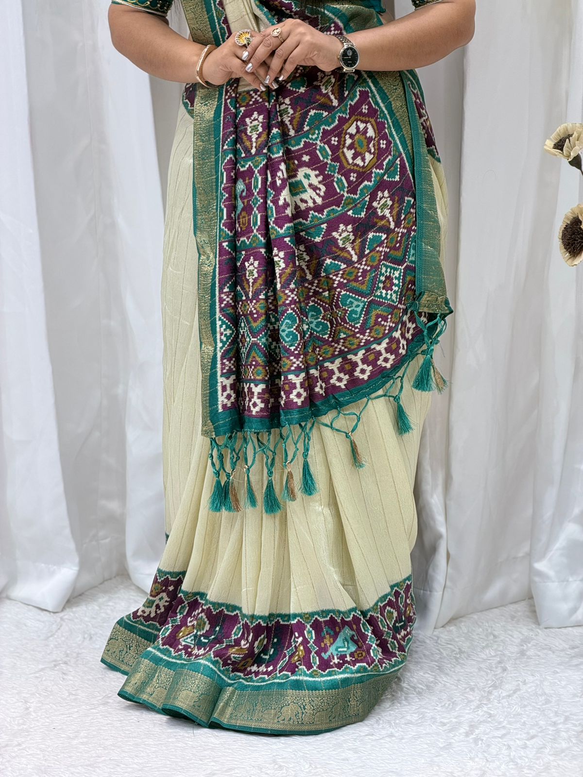 Elegant Cream & Teal Patola Print Saree with Rich Pallu & Tassel Detailing