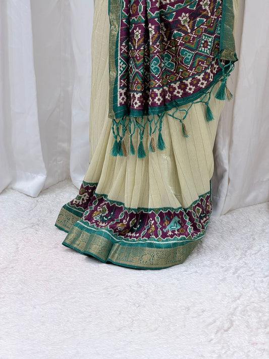 Elegant Cream & Teal Patola Print Saree with Rich Pallu & Tassel Detailing