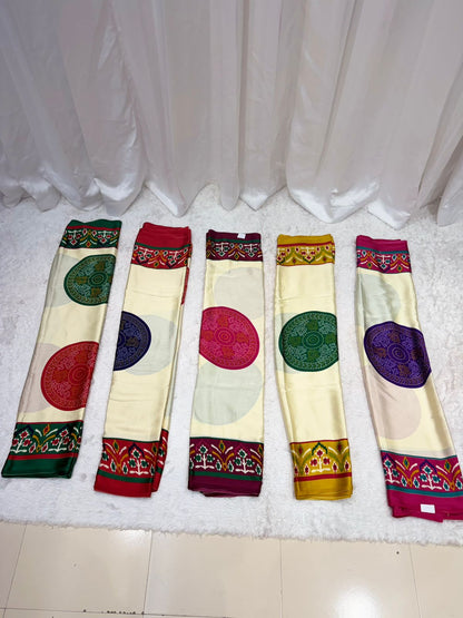 Elegant Cream Printed Saree with Teal Border & Multicolor Traditional Motifs